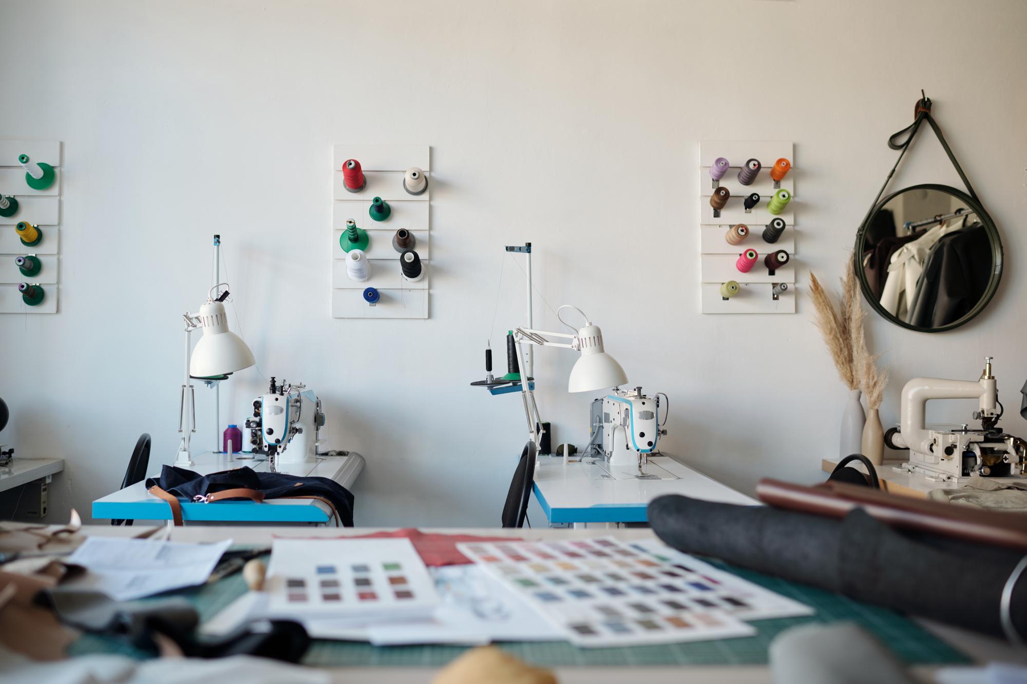 Studio bench with embroidery machine and threads