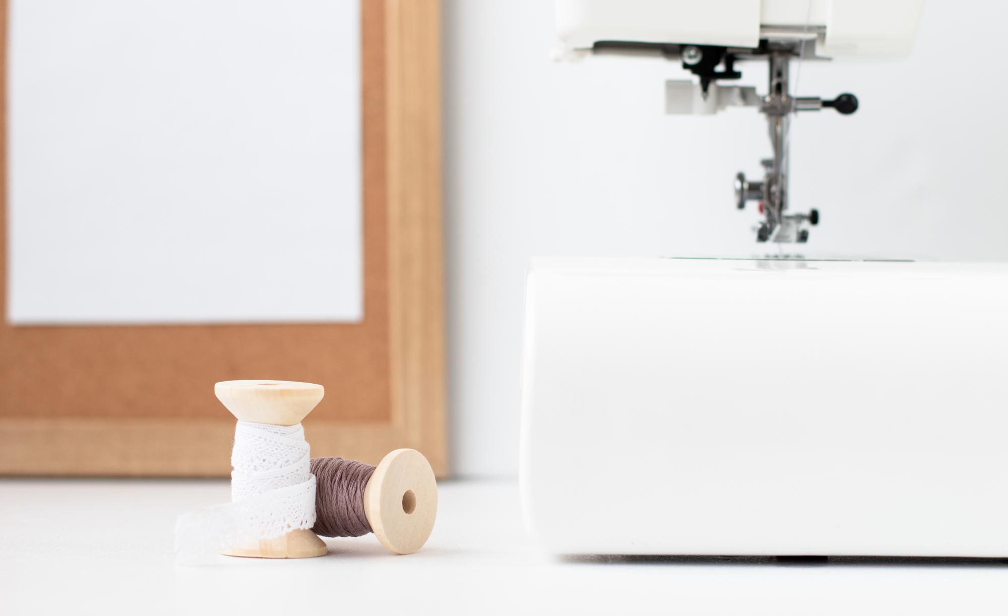 Workshop table with threads and machine in studio